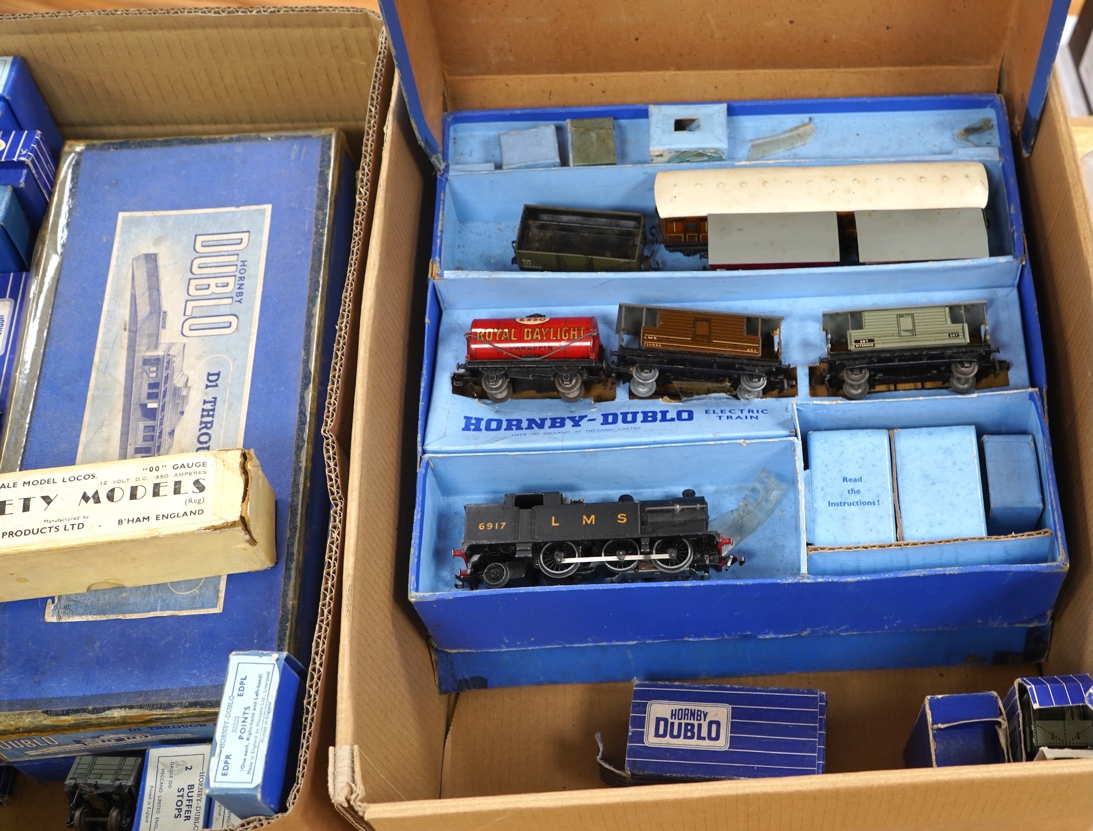 A quantity of Hornby Dublo for 3 rail running, including; an LMS Tank Goods Train set, comprising of an LMS class N2 0-6-2T locomotive, 6917, and wagons, together with the remains of another goods train set, including a